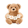Brown teddy bear holding blocks with the letters B A B Y