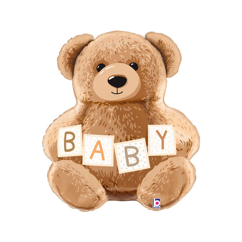 Brown teddy bear holding blocks with the letters B A B Y