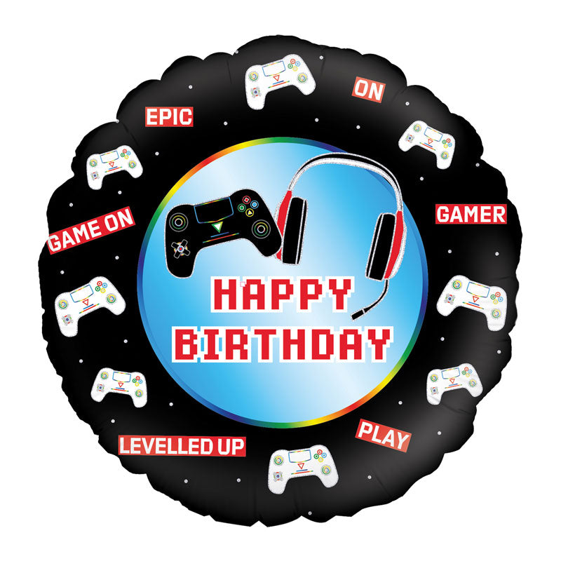 Round balloon with black surrounding background and blue centre, featuring gaming controllers and red headphones with happy birthday written in red low pixel design text.
