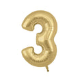 Gold balloon in the shape of the number three