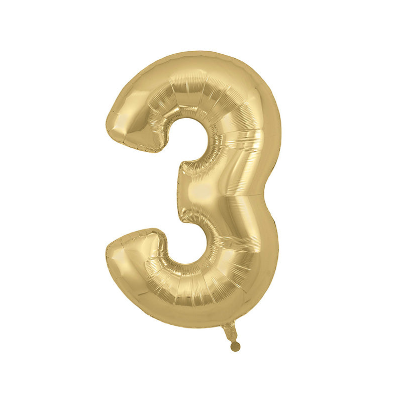 Gold balloon in the shape of the number three