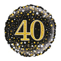 Foil balloon with number 40 on a black background with gold and silver confetti